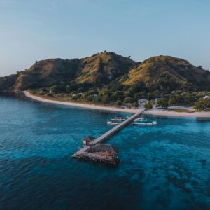 Aerial view of a scenic island with a pier in East Nusa Tenggara, Indonesia.